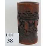 An antique Chinese carved bamboo brush pot or bitong, circa 1900. The front deeply decorated with