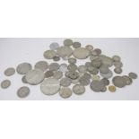 An assortment of coins to include German, Dutch, French, Fiji, East African, New Zealand and Great