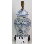 A blue and white Chinese porcelain covered jar table lamp on turned wooden base, height 38cm.
