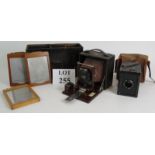 An early 20th Century Pony Premo No 3B folding camera with teak slides and original case, plus a