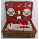 A vintage Harrods Coracle whicker picnic basket fully fitted with six place settings and various