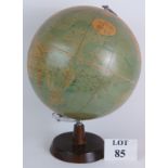 A Phillips' 13.5'' terrestrial Globe dated 1958 on turned wood stand. Overall height 47cm. Condition