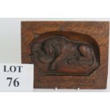 A deeply carved oak Swiss black forest panel depicting The Lion of Lucerne, 21cm x 17cm. Condition