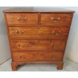 A Georgian mahogany chest of two short over three long graduated cock beaded drawers with brass swan