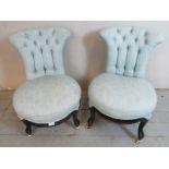 A pair of Victorian button back circular nursing chairs upholstered in a duck egg blue pattered