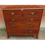 A Georgian mahogany straight front chest of two short over three long graduated cock beaded drawers,