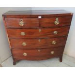 A Georgian mahogany boxwood strung bow fronted chest of two short over three long graduated cock