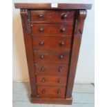 A 19th century Wellington chest of seven graduated short drawers each with twin turned wooden knob