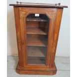 A Victorian walnut marquetry inlaid side cabinet, with brass gallery rails and glazed door opening