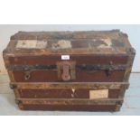 A 19th century dome topped leather, wood & metal band travelling trunk, bearing various numerous
