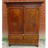 A 19th century mahogany double wardrobe with field panels to doors and four dummy drawers to base,