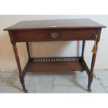 An Edwardian mahogany writing desk with lockable raising lid opening to reveal letter racks &