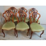 A set of 6 Victorian walnut balloon back dining chairs, with carved and pierced back splats