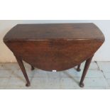 An 18th century oak oval drop leaf table, raised on tapering supports with pad feet. Estimated: £