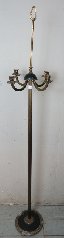 A 19th century brass floor standing four branch candelabra, with a fluted column terminating on a