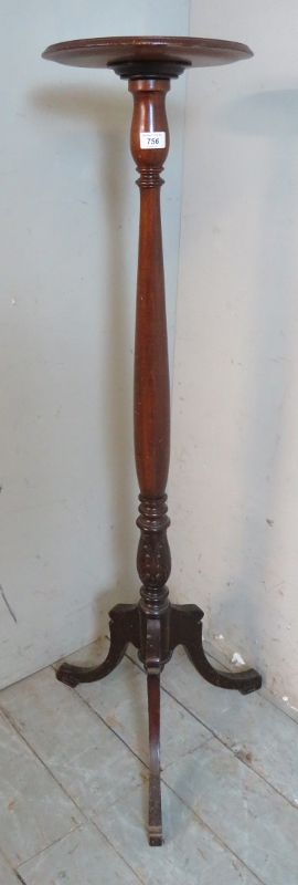 A Victorian mahogany torchere with dished top over a baluster turned & acanthus carved pedestal,