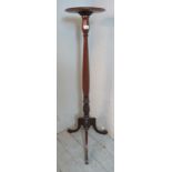 A Victorian mahogany torchere with dished top over a baluster turned & acanthus carved pedestal,