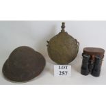 A WW2 steel helmet stamped 1939, a large brass Ottoman powder or water flask and a pair of