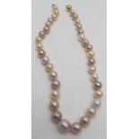 A freshwater pearl necklace in tones of champagne, pink, peach, cream & purple, with a 9ct gold ball