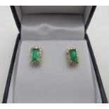 A pair of 18ct yellow gold rectangular emerald & diamond cluster studs with 18ct yellow gold