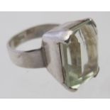 A silver ring set with an emerald cut citrine, approx 20mm x 16mm, stamped 925, size M. Condition