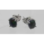 A pair of black cabochon Ethiopian opal stud earrings, posts and backs stamped 925. Condition