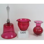 A 19th Century cranberry glass rinser, a large cranberry glass bell and antique cranberry glass vase