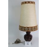 A very cool mid century West German pottery dual bulb table lamp with pierced lit base and period