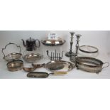 A selection of mainly early 20th Century silver plated items including candlesticks, fruit bowls,