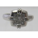 An 18ct white gold square set ring, set with a block of nine diamonds, approx 40pts, size L,