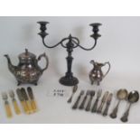 An ornate late Victorian silver plated teapot and jug, a two branch candelabra and a quantity of