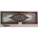 A highly intricate fretwork wooden panel in mahogany frame, 118cm x 40cm. Condition report: Some