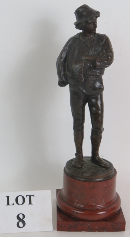 A fine quality bronze figure of a peasant boy, circa 1900, signed Fritz Heinemann, mounted on a