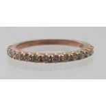 A 9ct rose gold fifteen diamond half eternity ring, round brilliant cut diamonds, 0.35cts approx,