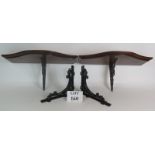 A pair of Serpentine shaped mahogany bracket shelves on cast iron supports plus a pair of cast