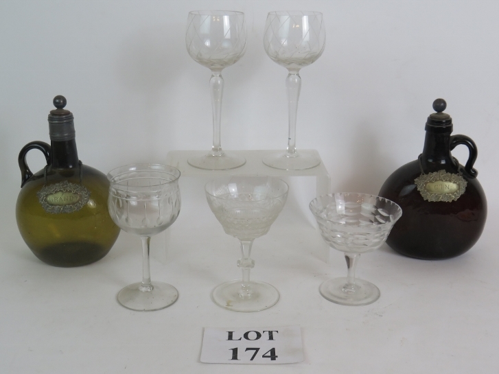 Two handblown 19th Century 'Chestnut' liqueur flasks with stoppers and labels plus five mixed 20th