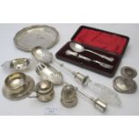 A collection of various mainly damaged items of silver to include a heavy pair of silver salad