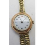 A 9ct gold ladies Rolex wristwatch on a yellow metal strap. Condition report: Watch good