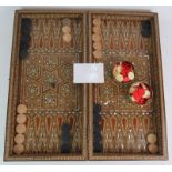 An inlaid Damascus Ware games box with backgammon board interior and chess board exterior. Bone