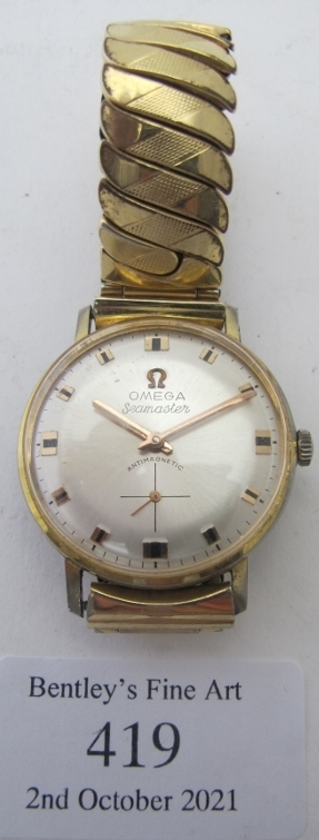 An Omega Seamaster antimagnetic gentleman's wristwatch with expanding yellow metal strap.