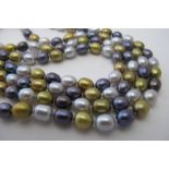 Freshwater pearl necklace, 60" length, 98 grams, new condition. Golden, chocolate, oyster shades,