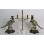 A pair of decorative bronze and porcelain parrot candlesticks, plus a height adjustable two candle