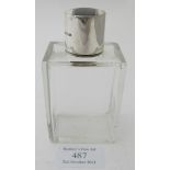 A rectangular glass scent bottle with black & white enamelling on the silver top, Birmingham 1930.