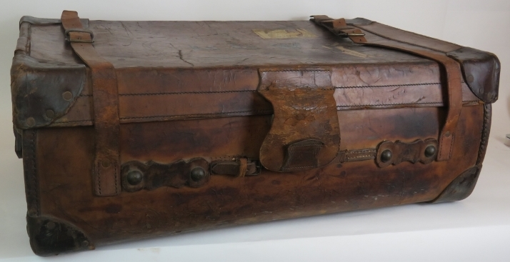 An antique leather travel trunk with wood slatted base and period labels. 82cm x 50cm x 30cm. - Image 2 of 4
