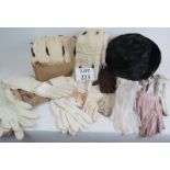 A 1950s ermine collar and muff, an iridescent black feather ladies hat and a quantity of vintage