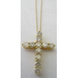 A 14ct yellow gold diamond cross pendant and chain, set with eleven round brilliant cut diamonds,