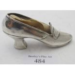 A ladies shoe pin cushion, marked sterling, lacking the cushion part. Condition report: Slight