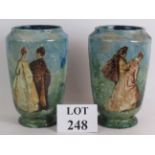 A pair of decorative ceramic vases with slip painted 19th Century figure decoration, signed D G to