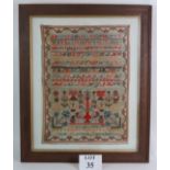 A 19th Century Scottish needlework sampler in oak frame, signed Annie Morrison Cairnbanno May 21st