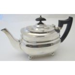 A silver bachelor size teapot on ball feet, approx weight 12.8 troy oz/400 grams, Sheffield 1936.